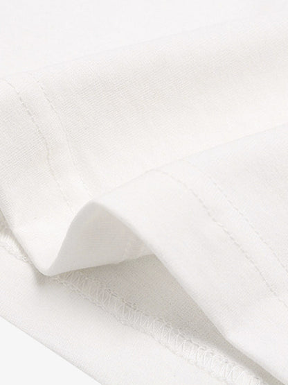 Close-up of white fabric with a subtle texture on a white background