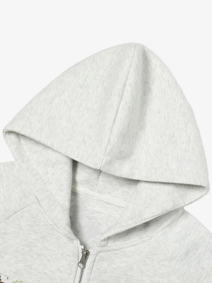 Stylish Graphic Hoodie with Unique Artwork and Fleur-de-Lis Design