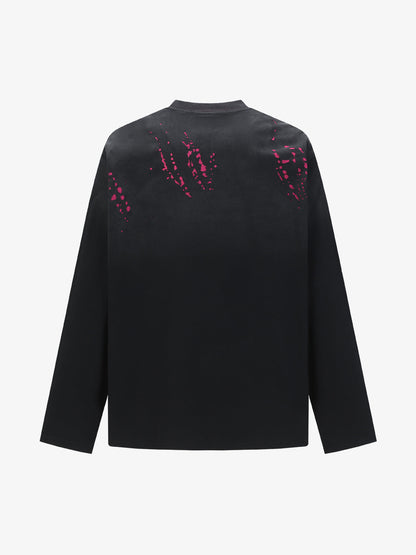 Stylish Black Long Sleeve Top with Pink Splatter Design for Modern Fashionistas