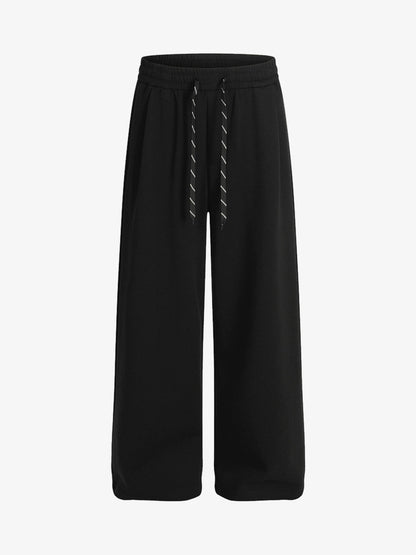 Checkered Wide-Leg Pants with Asymmetric Zippered Panel 