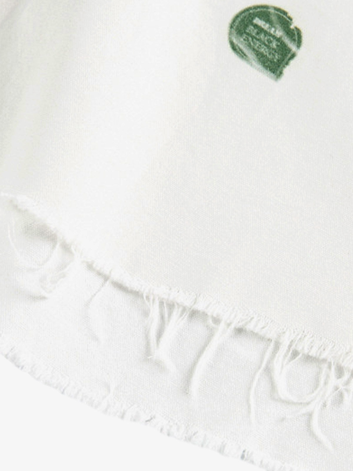 Stylish White Button-Up Shirt with Unique Patch Design for Casual and Trendy Looks?