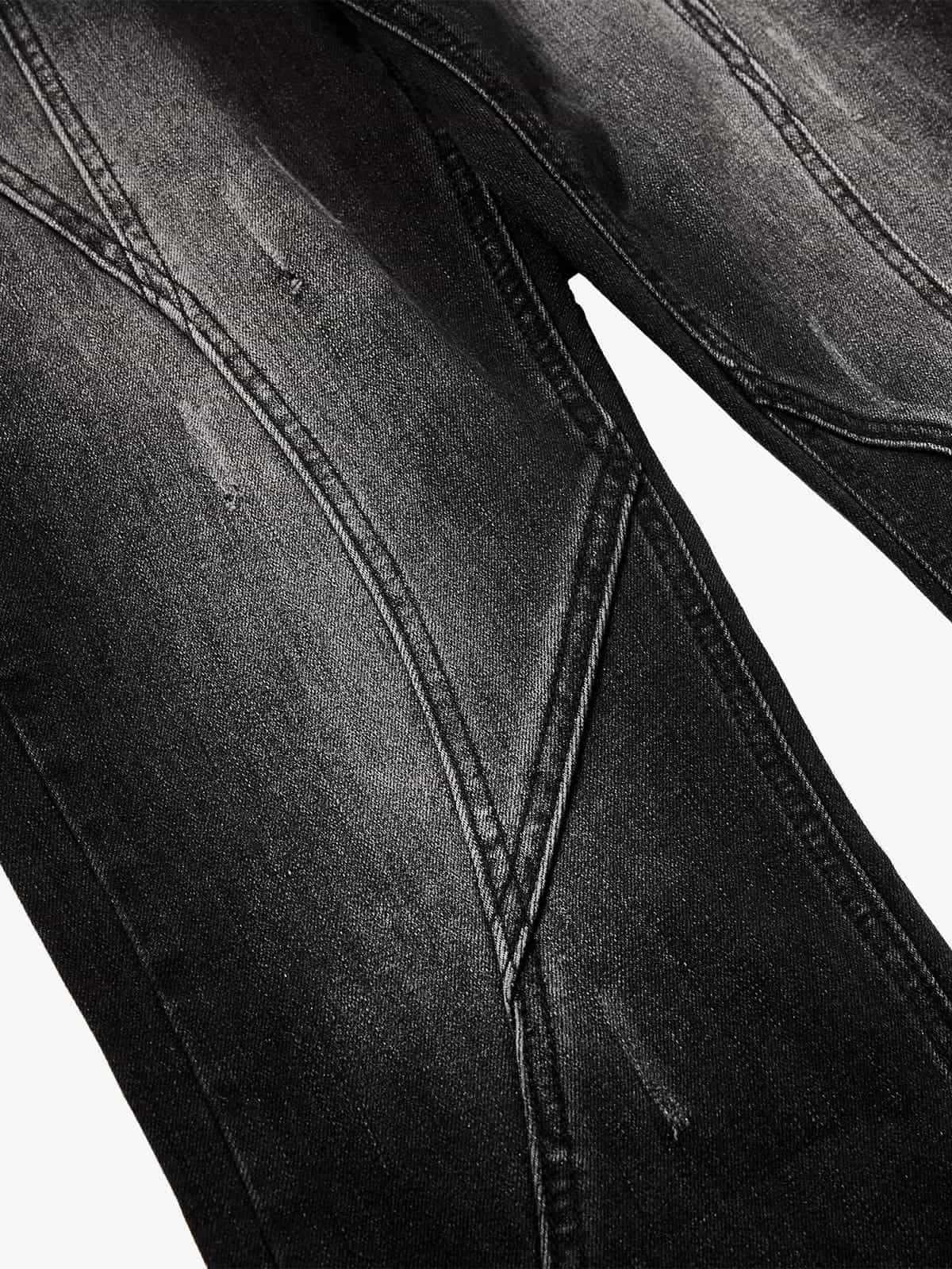 Black Denim Wide-Leg Jeans with Asymmetric Stitching and Button Details?