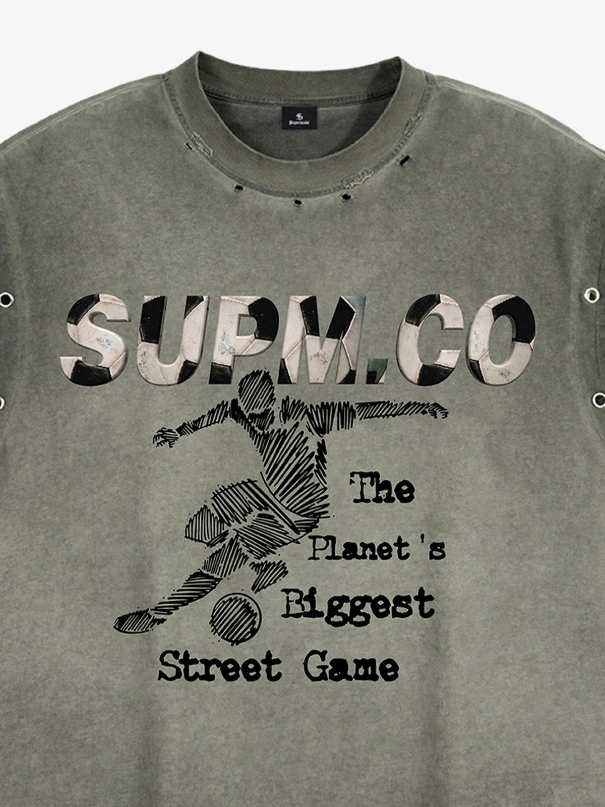 Distressed streetwear style loose sleeveless vest, decorated with a soccer print pattern and distressed and washed details, with metal eyelet details. 