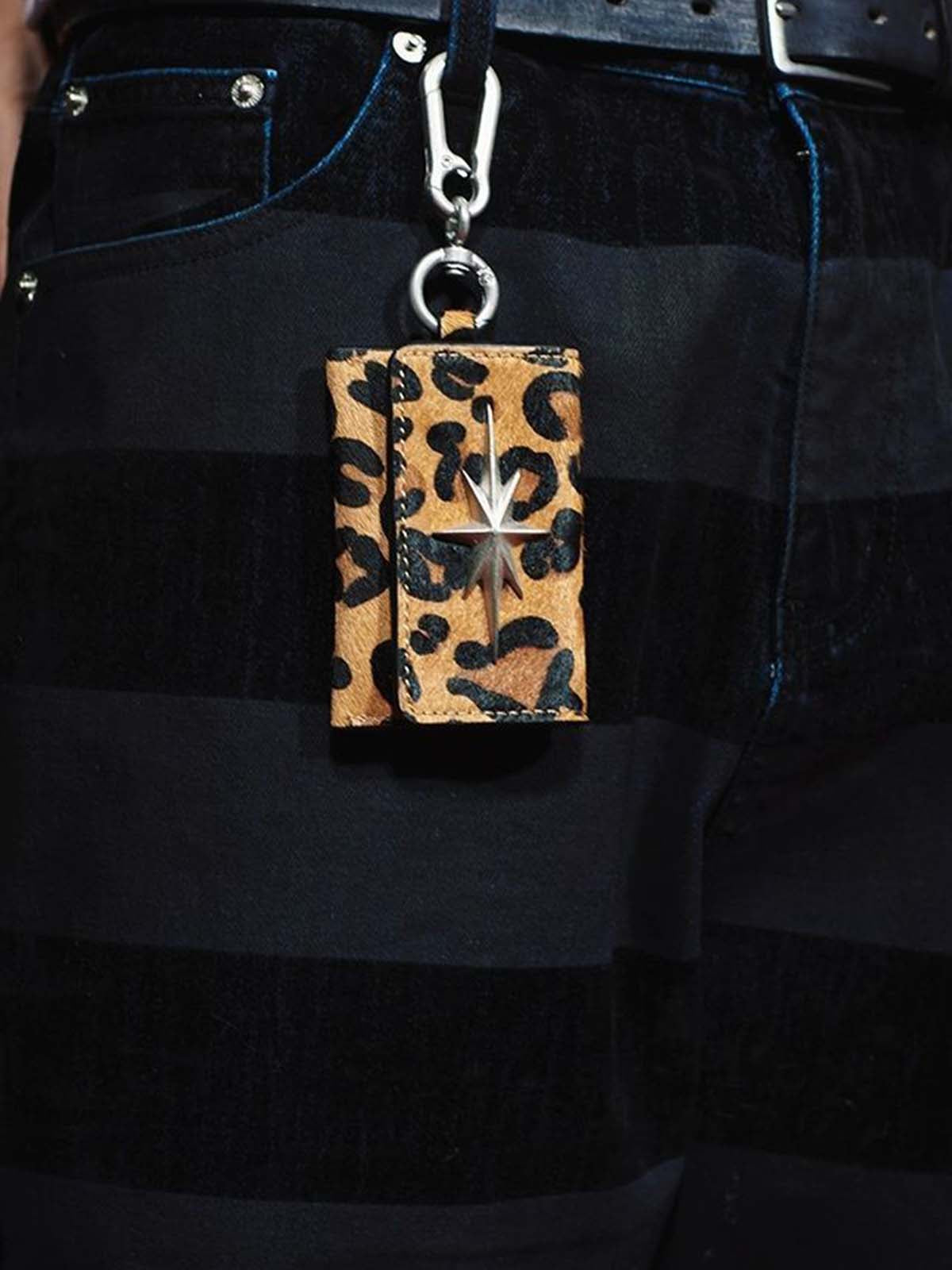 Leather Keychain with Star Emblem - Premium Black Leather Key Holder with Metal Clasp and Decorative Star Design?