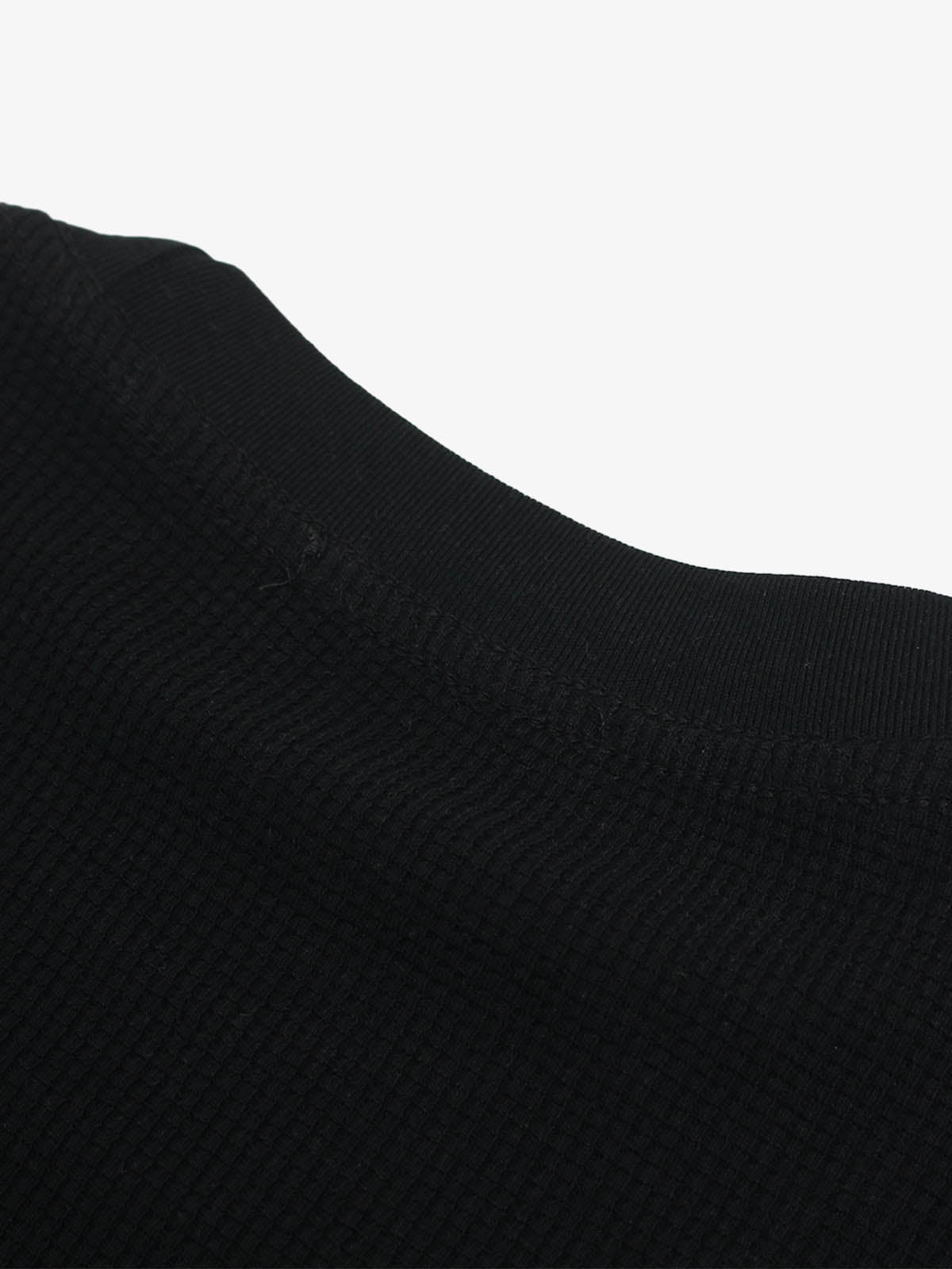 Cotton Oversized Graphic T-Shirt with Newspaper Print and Metal Eyelets?