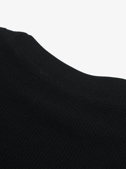 Cotton Oversized Graphic T-Shirt with Newspaper Print and Metal Eyelets?