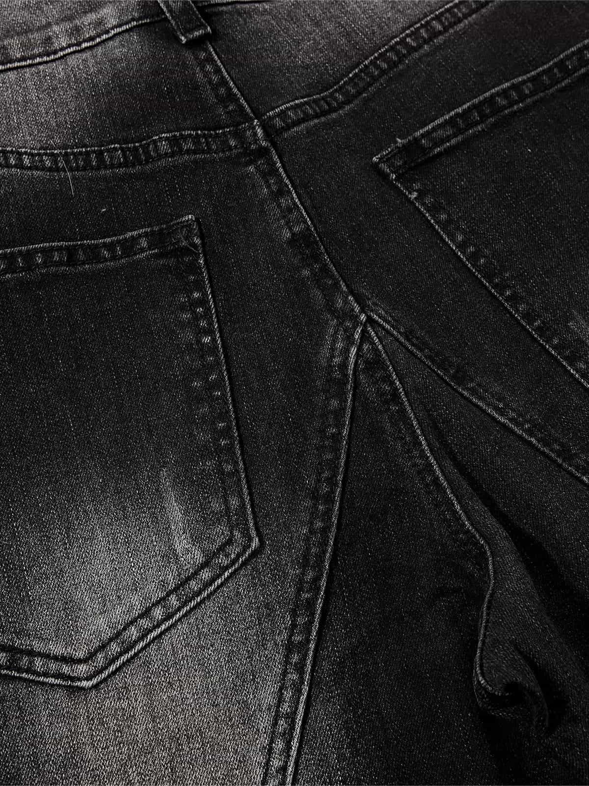 Black Denim Wide-Leg Jeans with Asymmetric Stitching and Button Details?