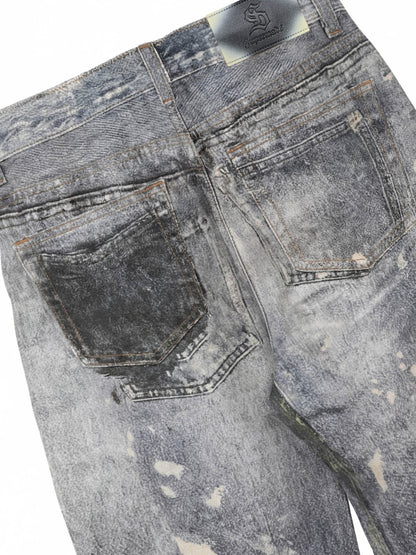 Distressed heavy-duty painted straight-leg jeans, adorned with red graffiti prints and paint-splatter wash effects?