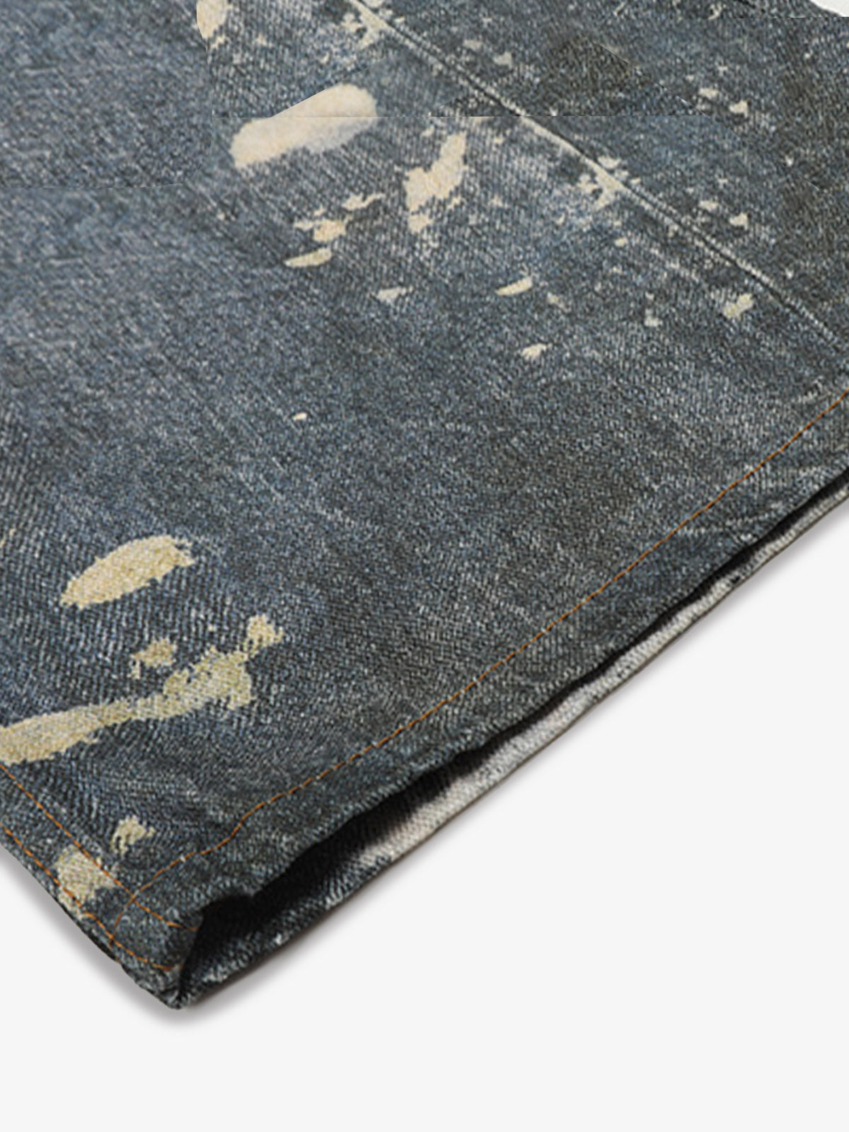 Distressed heavy-duty painted straight-leg jeans, adorned with red graffiti prints and paint-splatter wash effects?