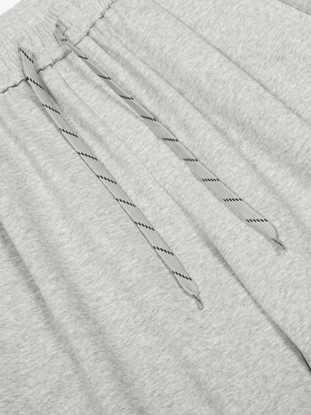 Checkered Wide-Leg Pants with Asymmetric Zippered Panel 