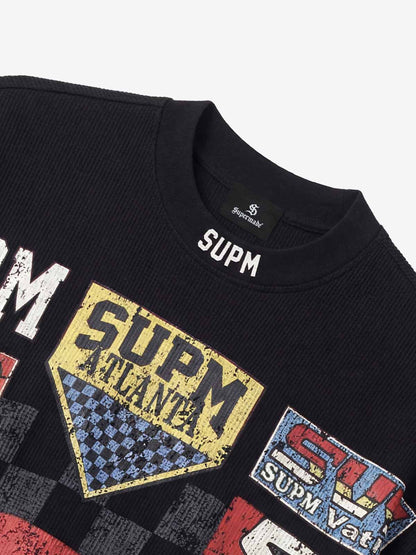 Cotton Oversized Graphic T-Shirt with Newspaper Print and Metal Eyelets?