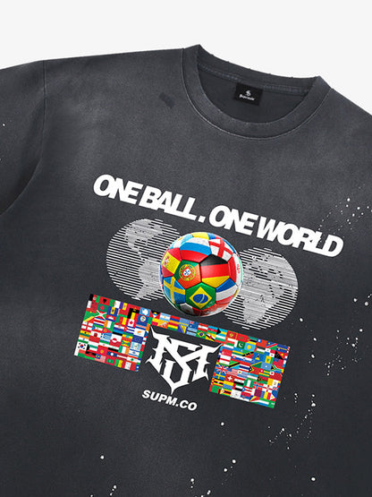 Unisex distressed loose-fitting cotton short-sleeved T-shirts featuring a "One ball, one world" slogan print and an ink-splatter wash finish. 