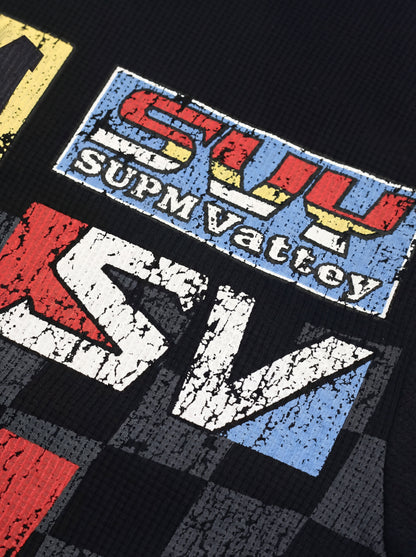 Cotton Oversized Graphic T-Shirt with Newspaper Print and Metal Eyelets?