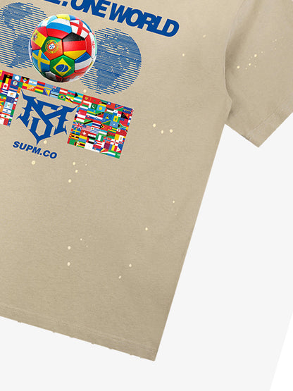Unisex distressed loose-fitting cotton short-sleeved T-shirts featuring a "One ball, one world" slogan print and an ink-splatter wash finish. 